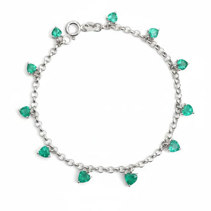 Pulsera de oro 14K con esmeraldas lab-grown en corte corazón distribuidas a lo largo de la cadena.