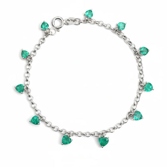 Pulsera de oro 14K con esmeraldas lab-grown en corte corazón distribuidas a lo largo de la cadena.